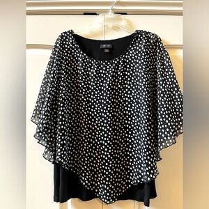 Black-and-white polkadot AB Studio tunic.